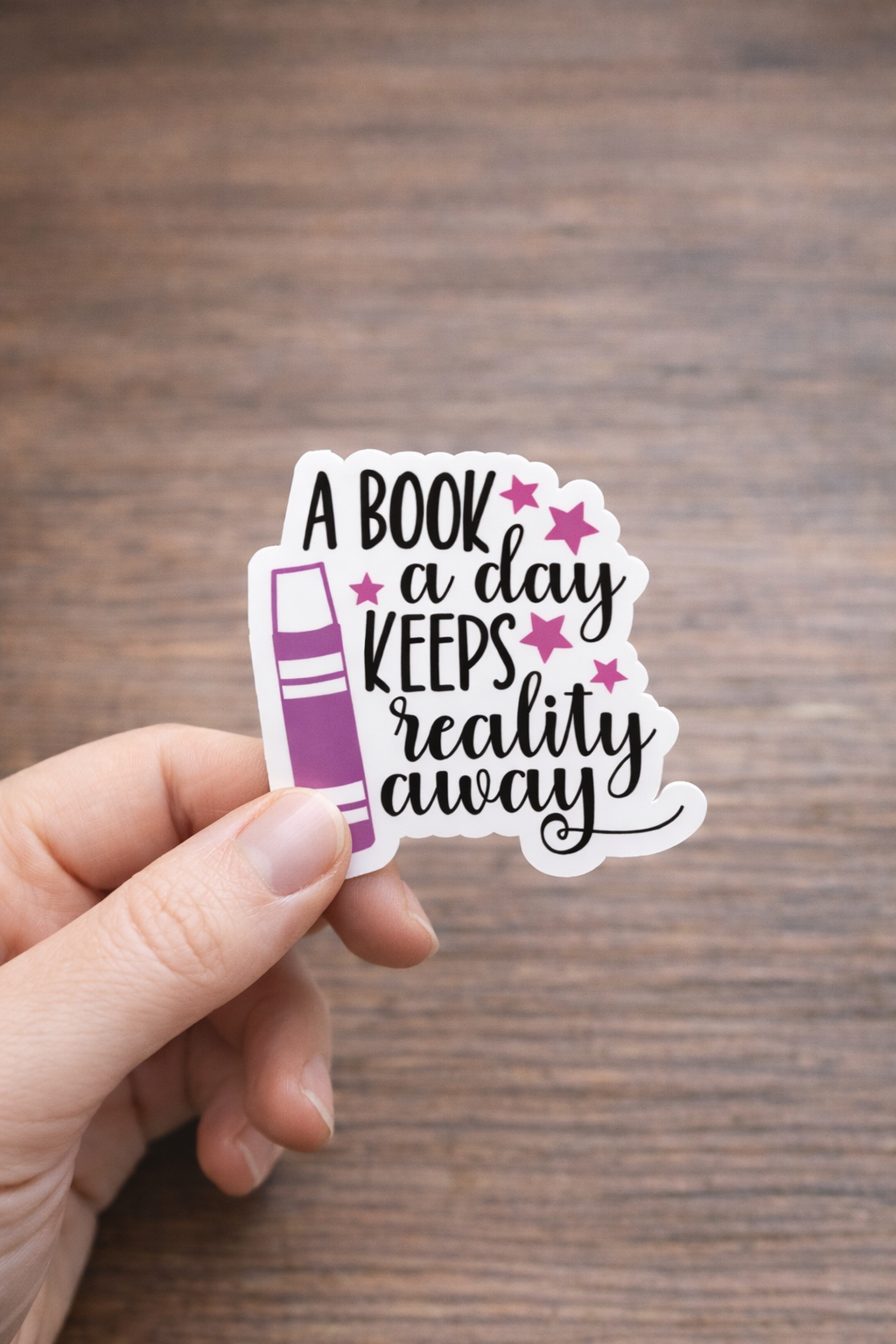A Book a Day Keeps Reality Away Sticker